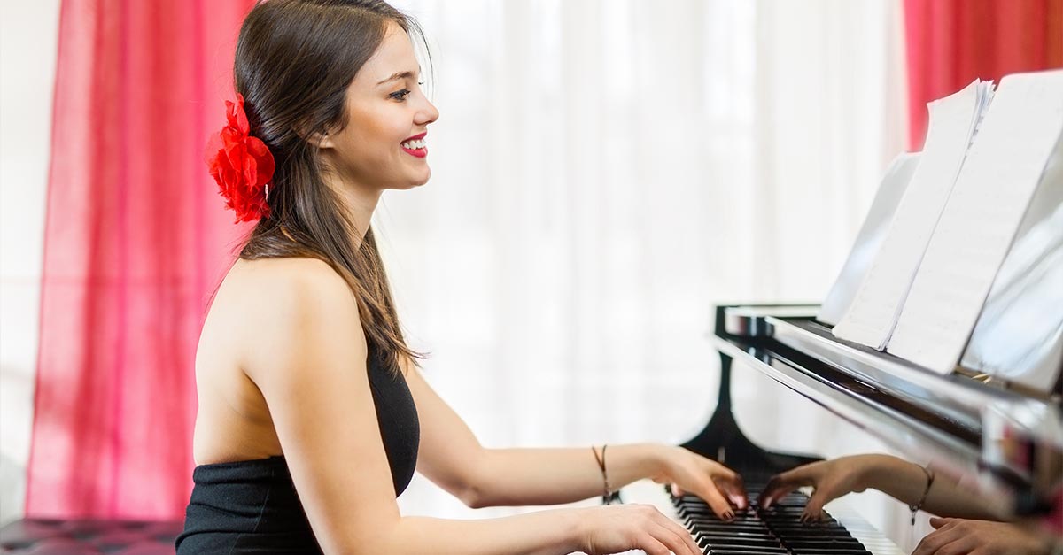 Beautiful woman playing piano