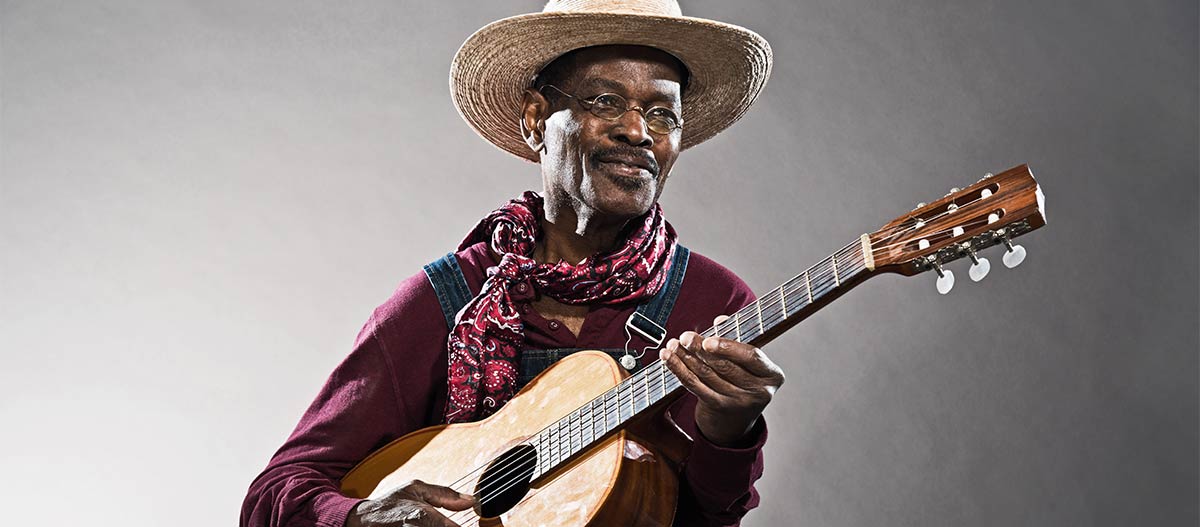 Black man playing guitar