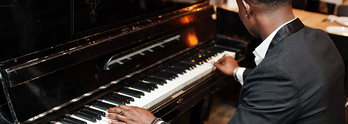 Black man playing piano