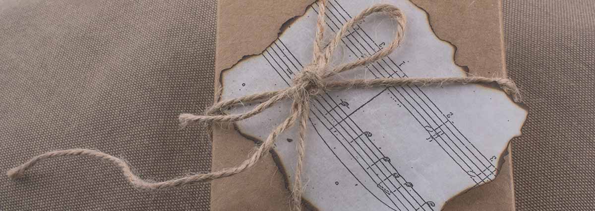 Burnt musical notes on a brown color wrapped gift