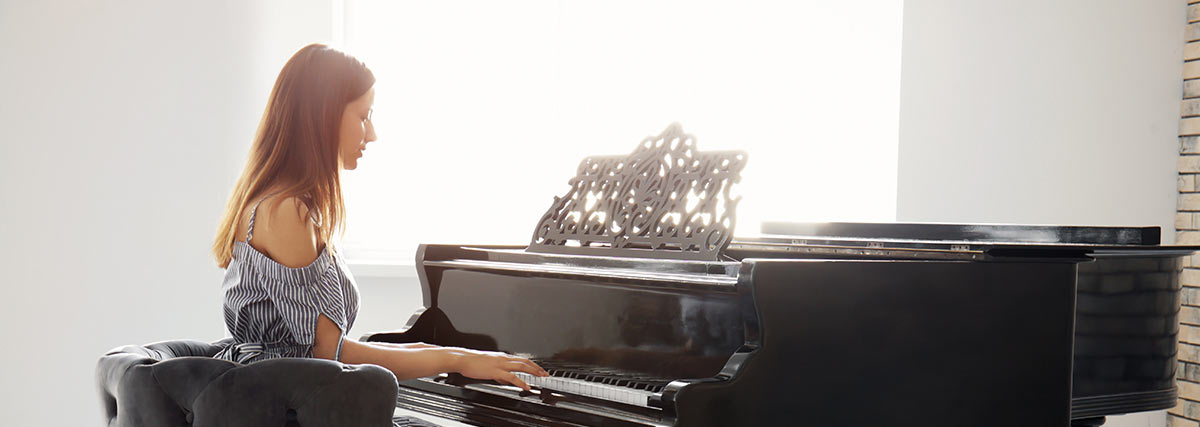 female practising the piano