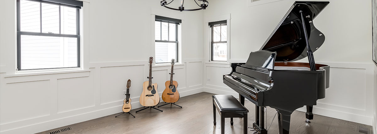Grand piano and guitars in the room