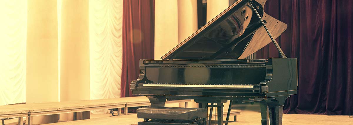 grand piano inside a hall