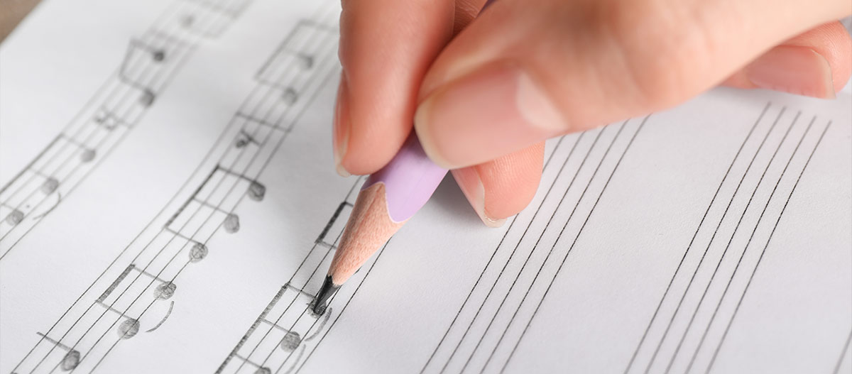 Hand writing music notes