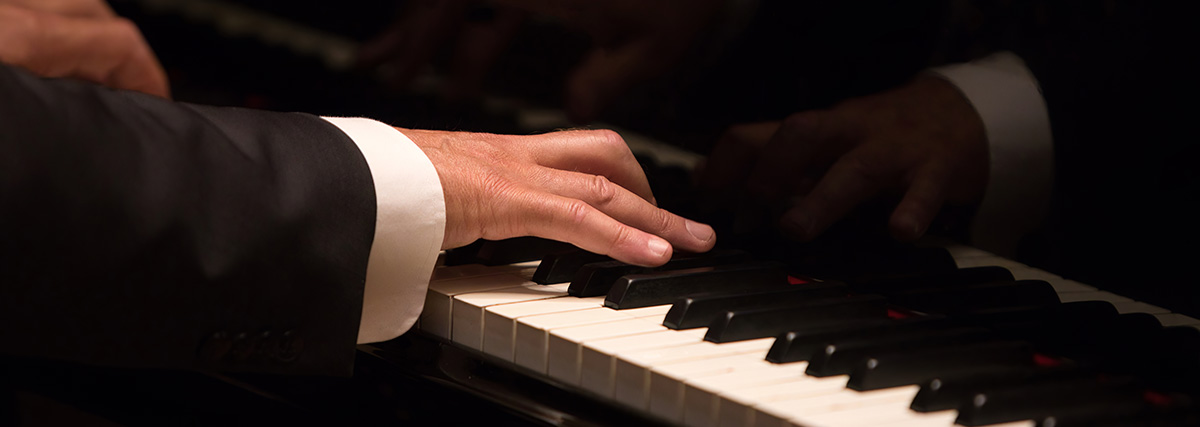 Hands playing piano