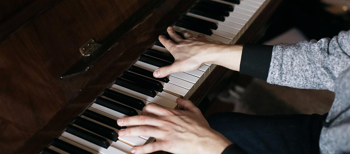 Hands playing piano
