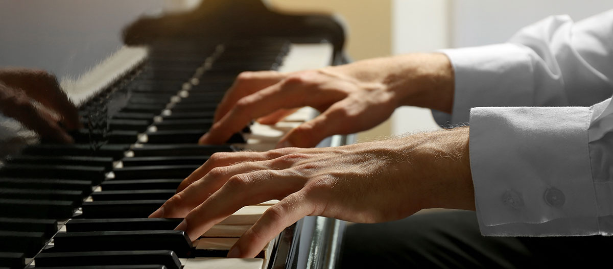 Hands playing piano