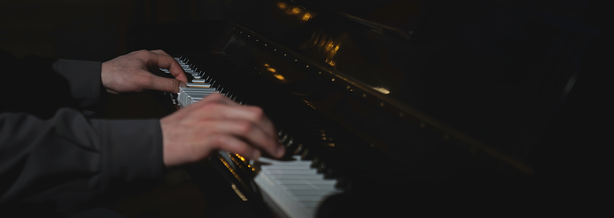 Hands playing piano