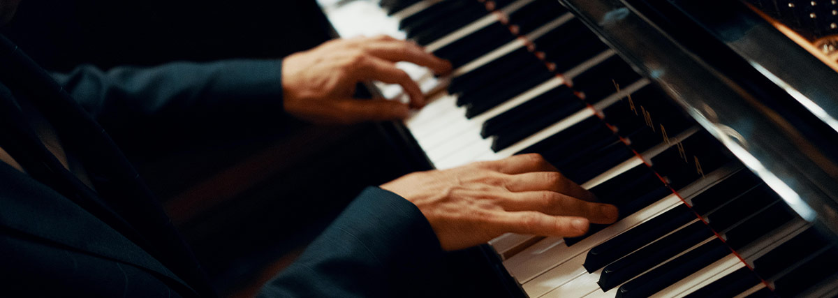 Hands playing piano