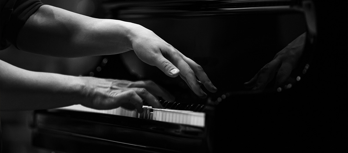 Hands playing piano