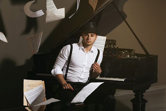 Handsome musician at the piano