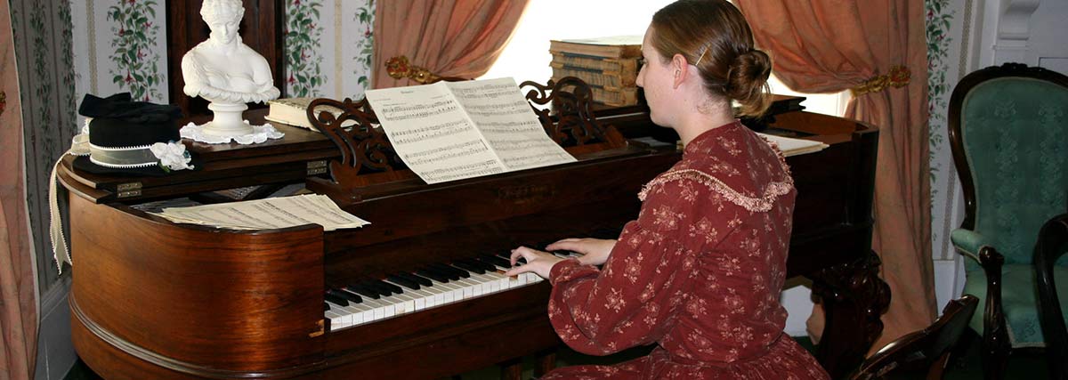 Lady playing piano at home