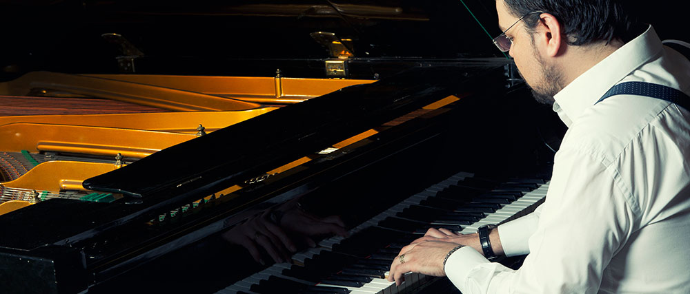 Man learning to play blues piano