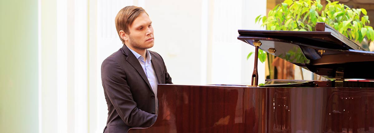 man performing on the grand piano