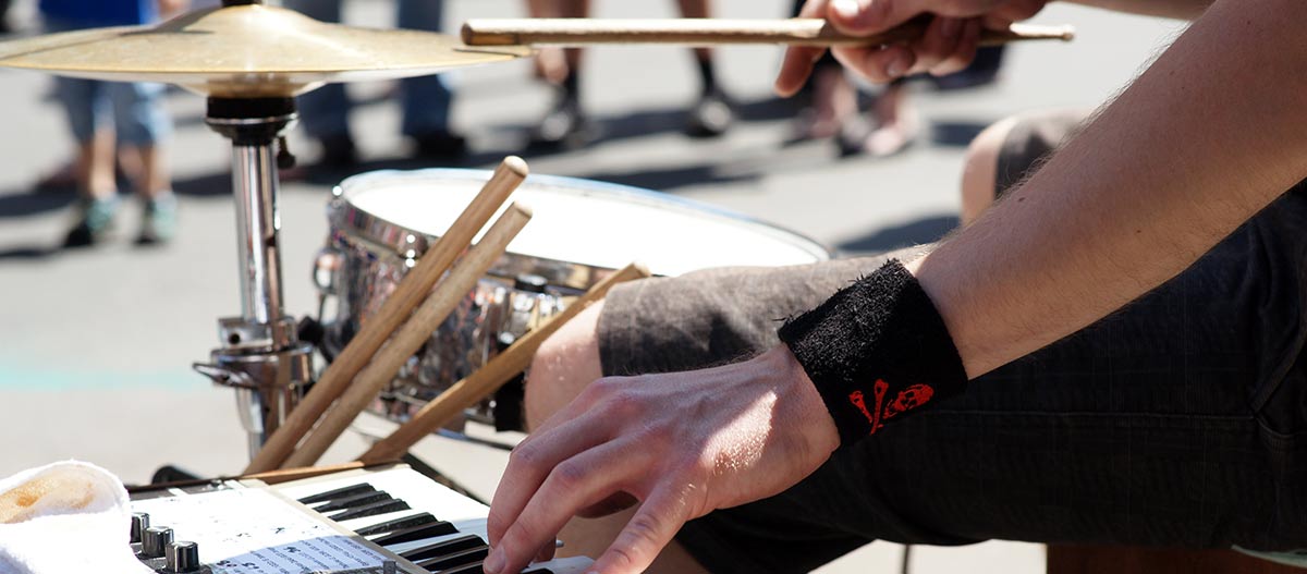 Man playing drums and keyboard on the street