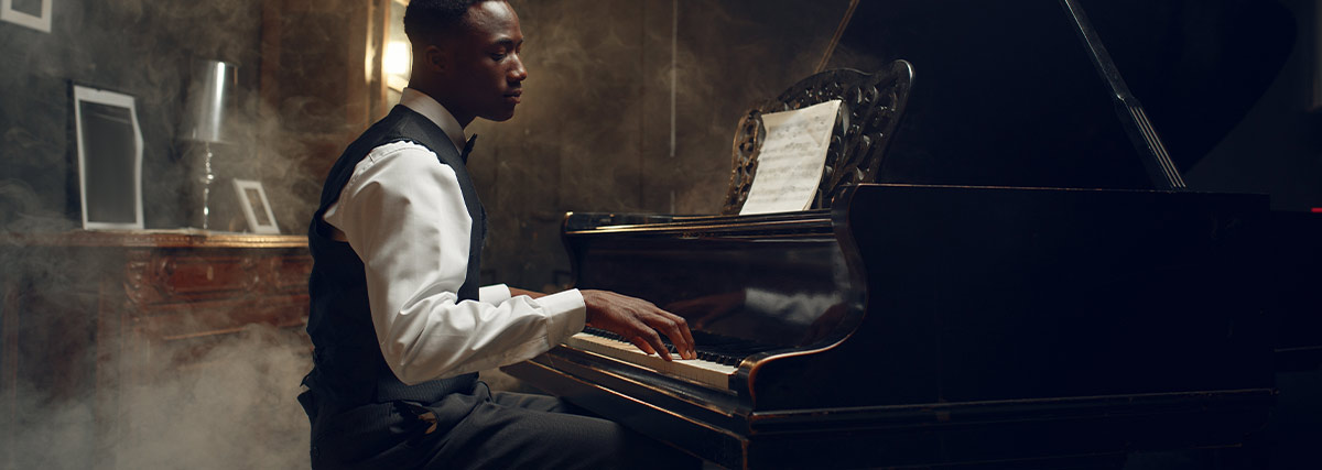 Man playing grand piano