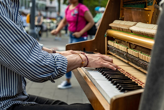 Man playing piano on the street