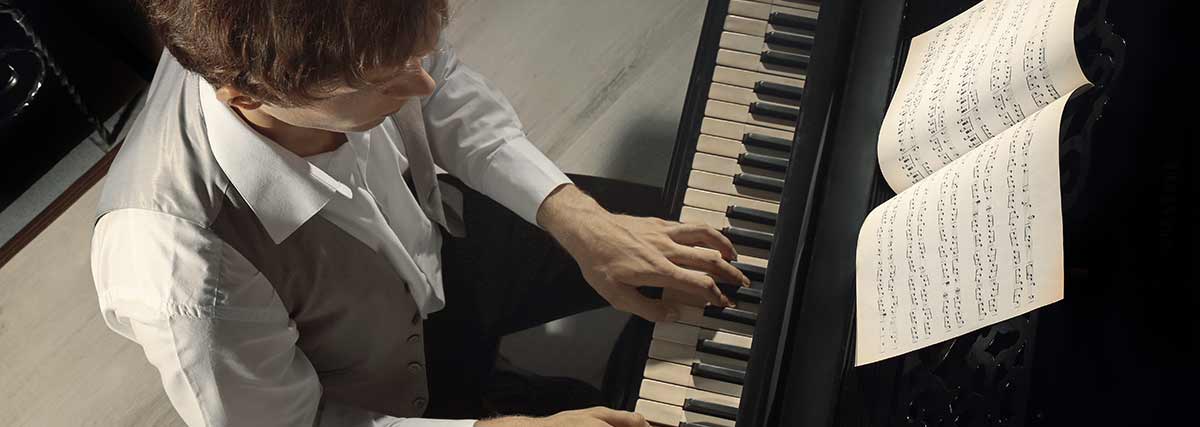 man-playing-the-grand-piano