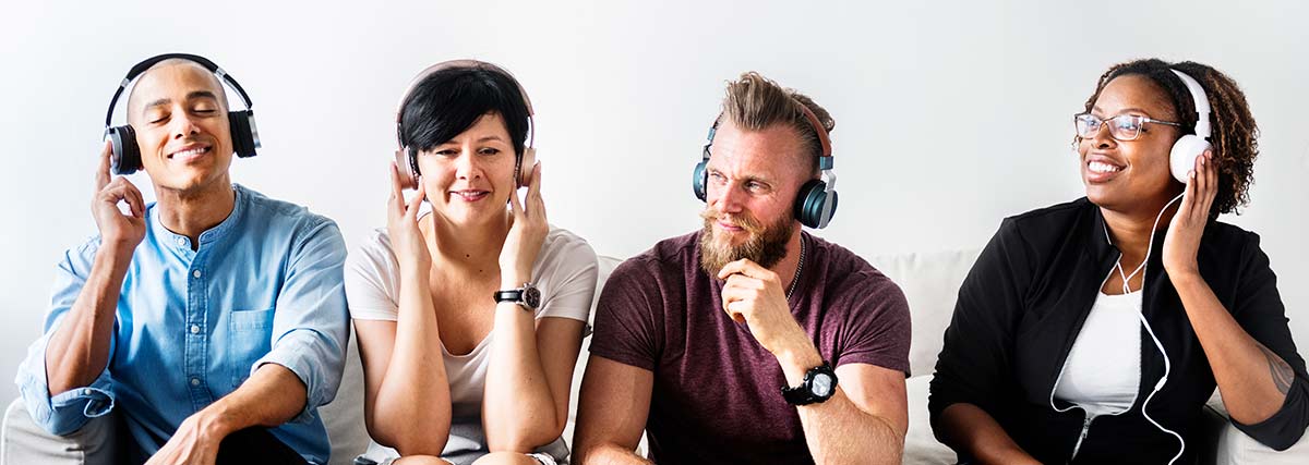 People listening to music together on headphones