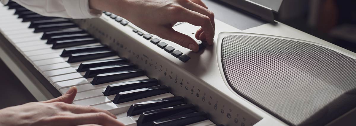 Pianist adjusting piano sound