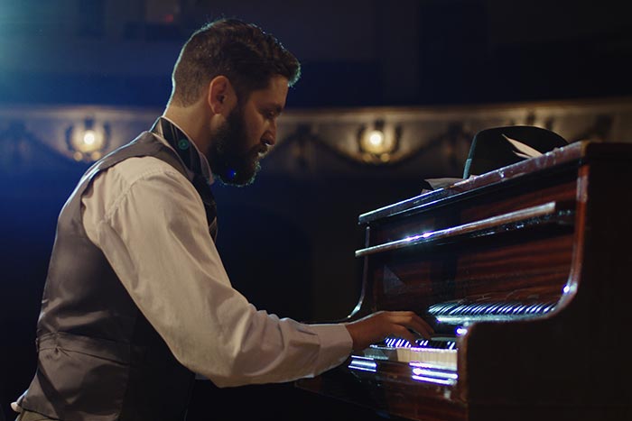 pianist performing on stage feat