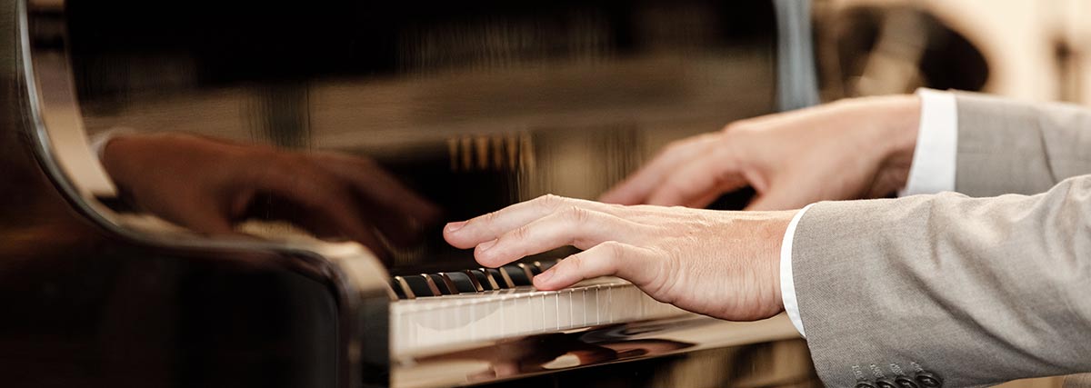 pianist performing on the piano