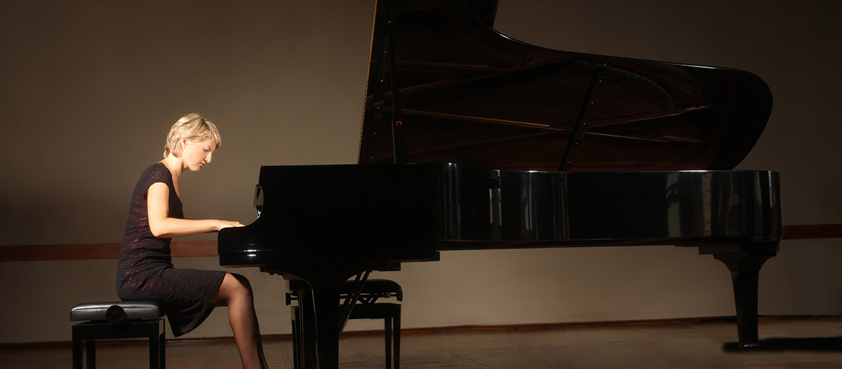 Pianist playing grand piano