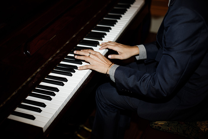 Professional pianist playing the grand piano