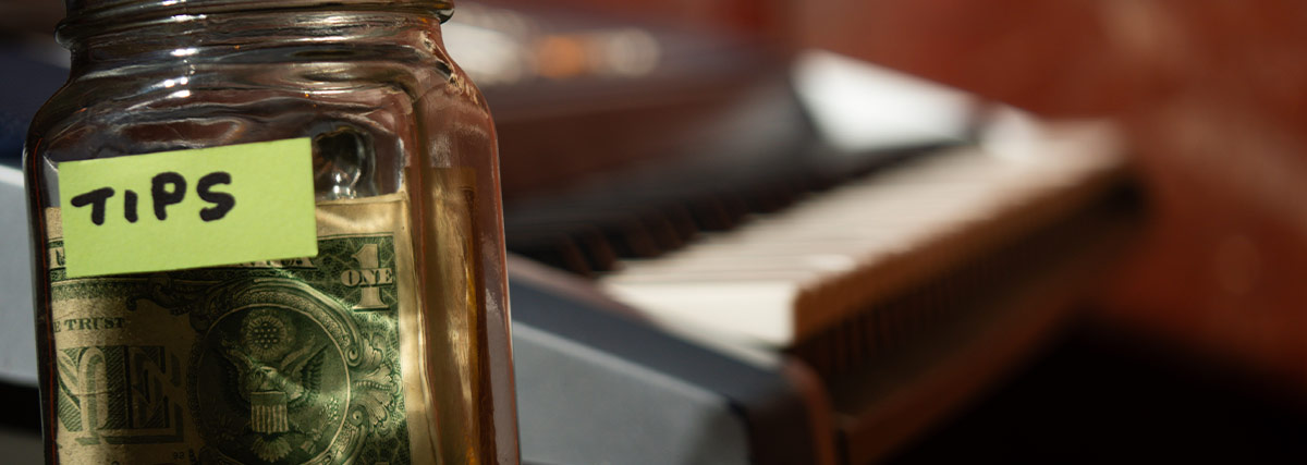 Tip jar with piano on the background