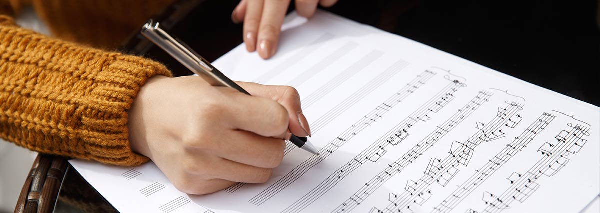 Woman hands composing music