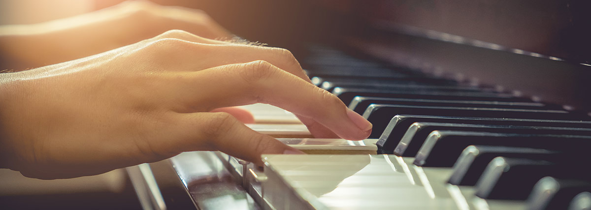 Woman hands playing piano