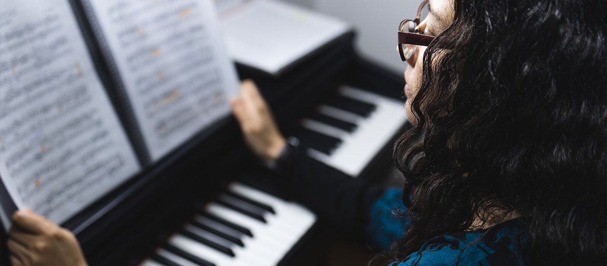 Woman holding a music sheet
