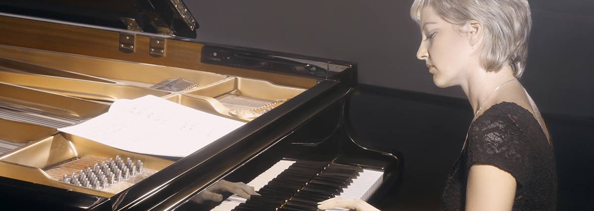 woman playing the grand piano