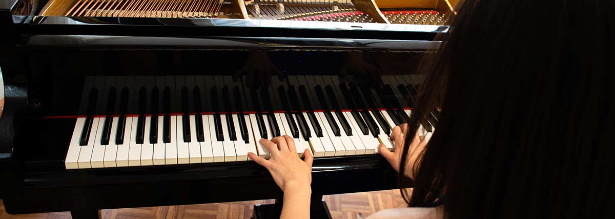 woman playing the piano
