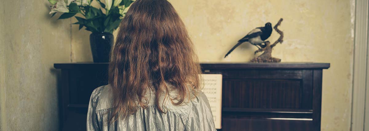 woman practising the piano