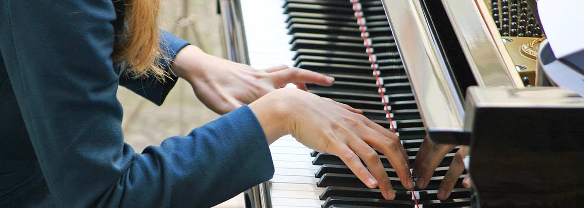 woman practising the piano