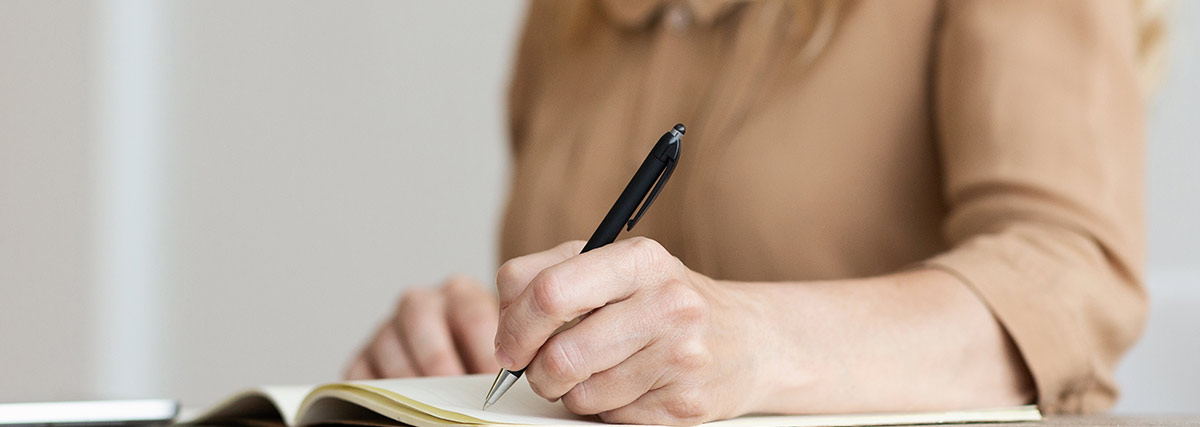 woman writing her schedule